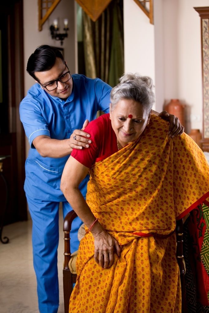 Indian nurse checking blood pressure
